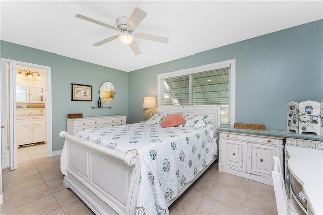 bedroom featuring ceiling fan, light tile patterned floors, and ensuite bathroom