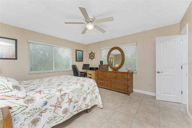 tiled bedroom featuring ceiling fan