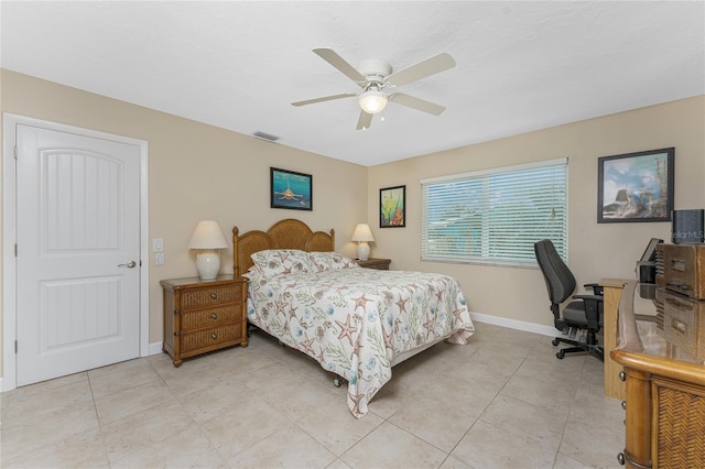 tiled bedroom with ceiling fan