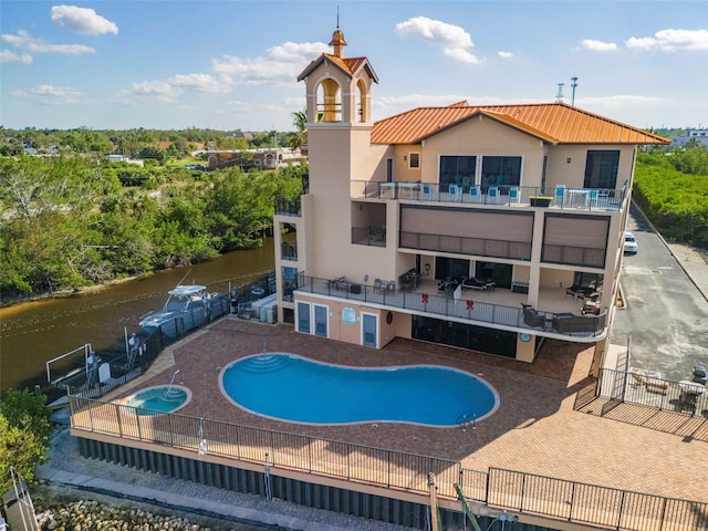 view of swimming pool with a water view