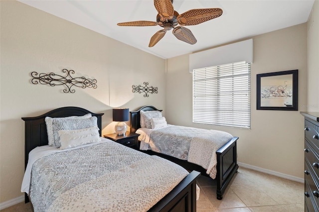 bedroom with light tile patterned floors and ceiling fan