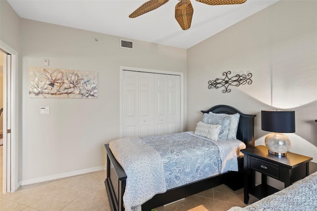 tiled bedroom featuring a closet and ceiling fan