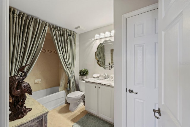 bathroom featuring tile patterned floors, vanity, and toilet