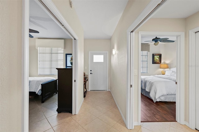 hallway featuring light tile patterned floors