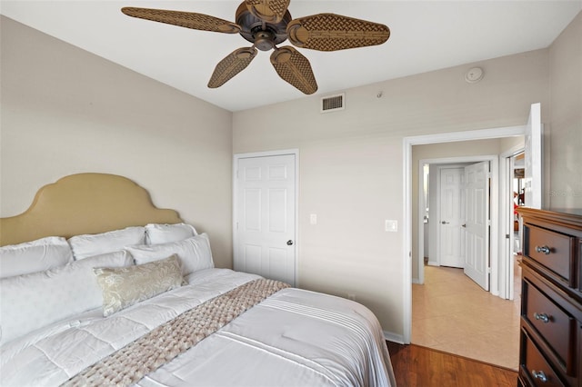 bedroom with hardwood / wood-style floors and ceiling fan