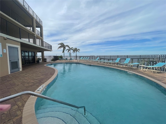 view of pool featuring a patio area