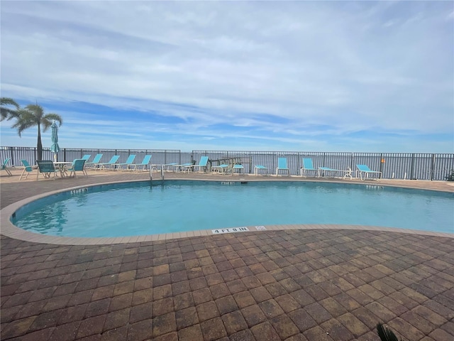 view of pool featuring a patio