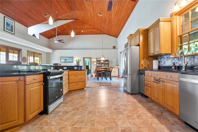 kitchen featuring decorative light fixtures, stainless steel appliances, high vaulted ceiling, and ceiling fan