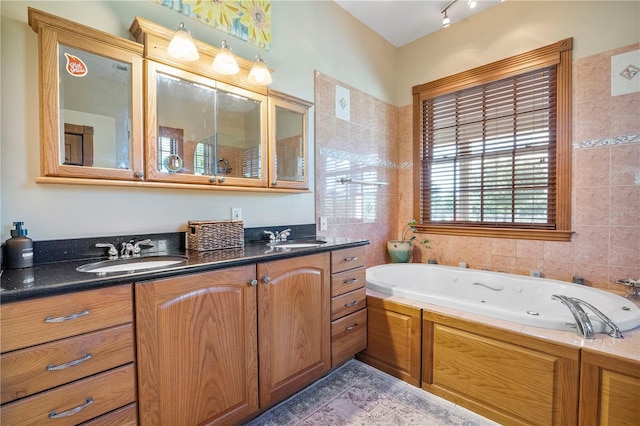 bathroom with vanity and a tub to relax in