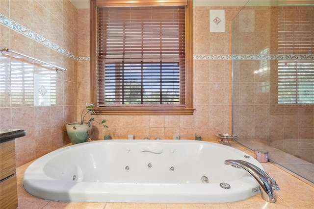 bathroom featuring tiled bath