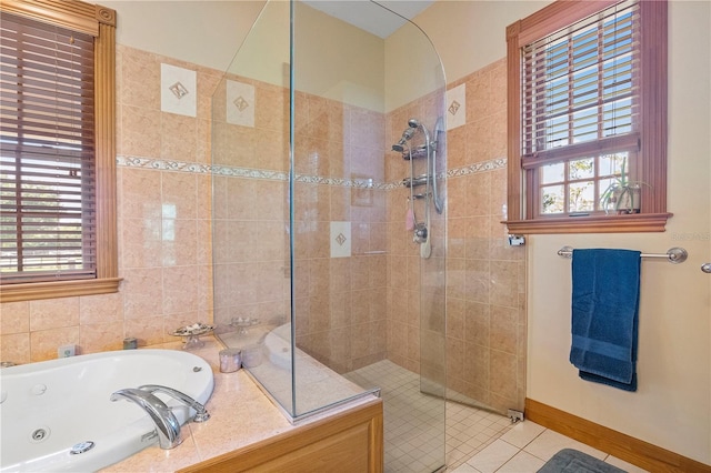 bathroom with tile patterned floors, a wealth of natural light, and shower with separate bathtub