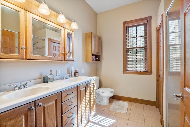 bathroom with tile patterned flooring, vanity, toilet, and an enclosed shower