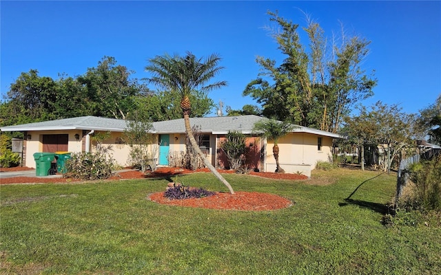 ranch-style home featuring a front yard