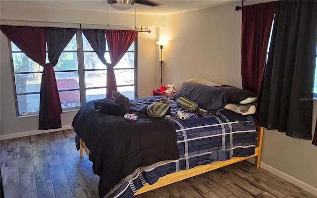 bedroom featuring ceiling fan and wood-type flooring