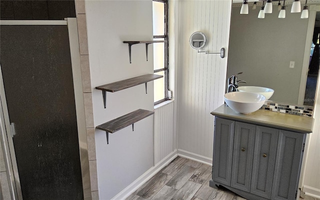 bathroom with hardwood / wood-style floors and vanity