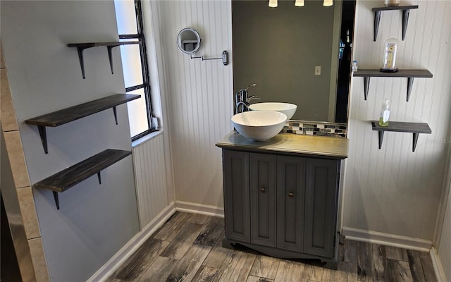 bathroom with vanity and hardwood / wood-style flooring