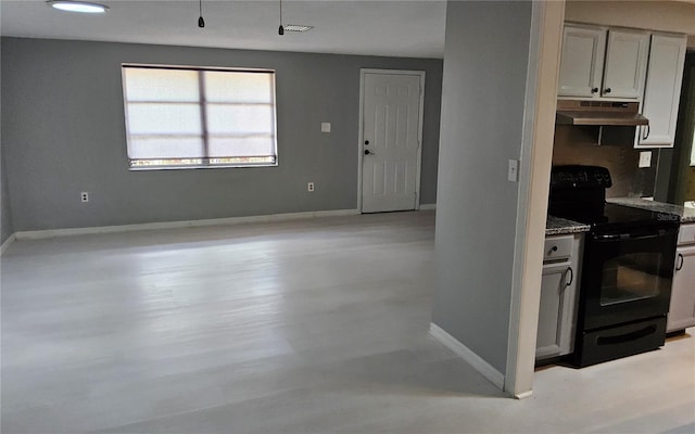 1108 Ample Ave, Port Charlotte, FL 33948 - kitchen featuring black range with electric cooktop, under cabinet range hood, and baseboards