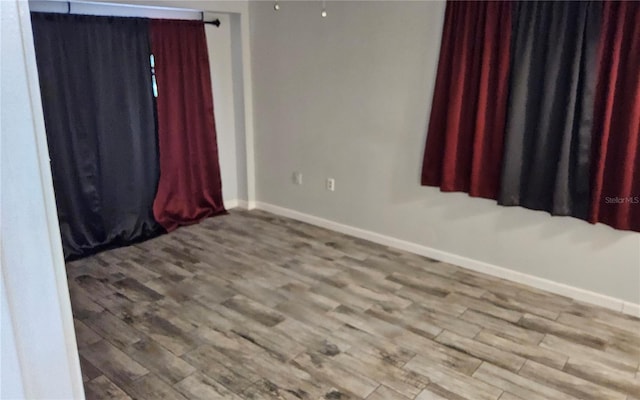 1108 Ample Ave, Port Charlotte, FL 33948 - spare room featuring wood finished floors and baseboards