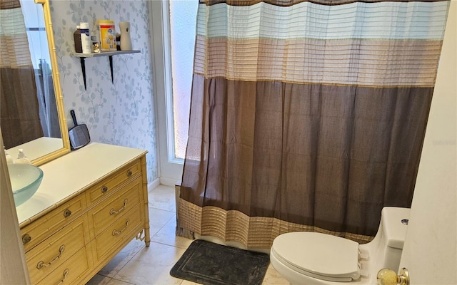 1108 Ample Ave, Port Charlotte, FL 33948 - bathroom with wallpapered walls, vanity, toilet, tile patterned flooring, and a shower with shower curtain