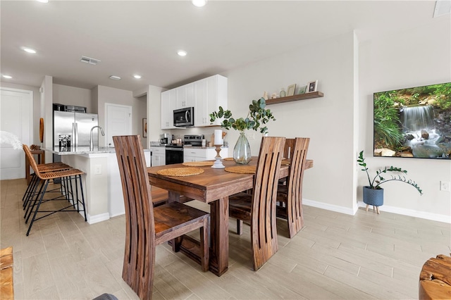 dining room featuring sink