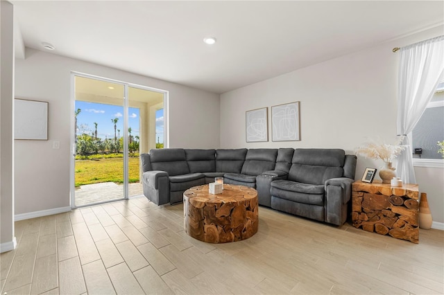 living room with light hardwood / wood-style flooring