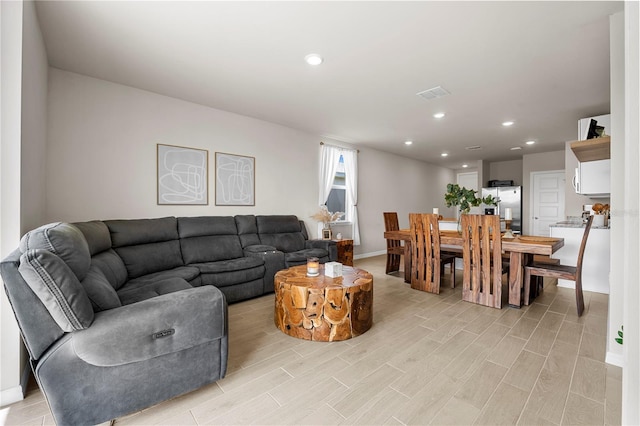 living room with light hardwood / wood-style floors