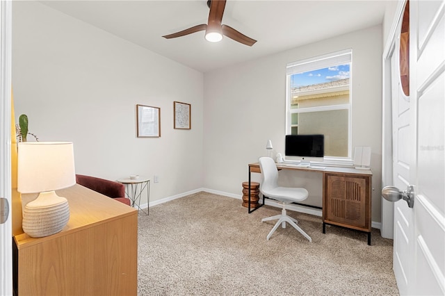 home office with light carpet and ceiling fan