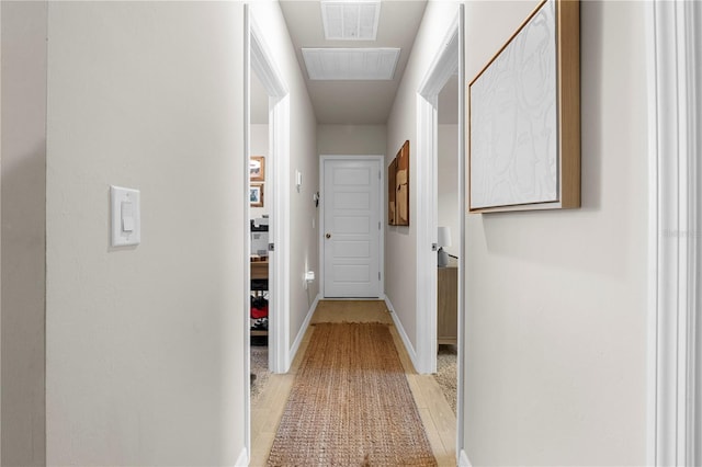 hallway with light wood-type flooring