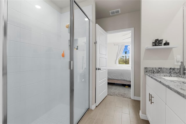 bathroom with vanity and an enclosed shower