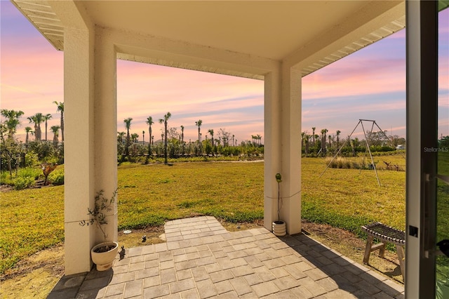 patio terrace at dusk with a lawn