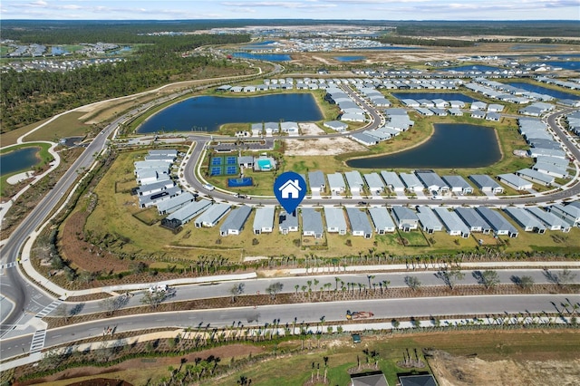 birds eye view of property with a water view