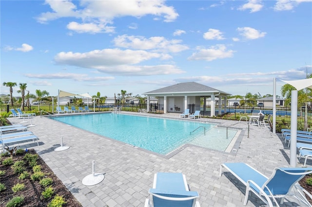 view of swimming pool with a patio area