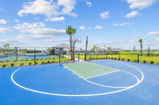 view of basketball court featuring tennis court