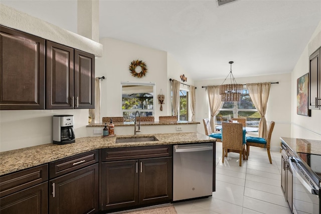 kitchen with stainless steel appliances, sink, pendant lighting, light tile patterned floors, and a chandelier