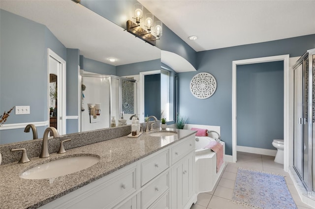 full bathroom featuring toilet, vanity, tile patterned floors, and plus walk in shower