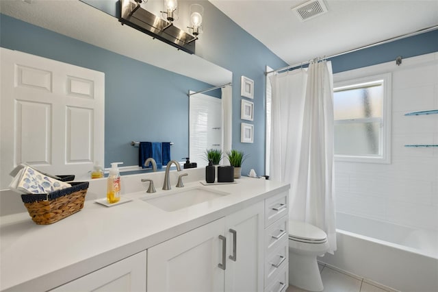 full bathroom featuring shower / bath combo, vanity, toilet, and tile patterned floors