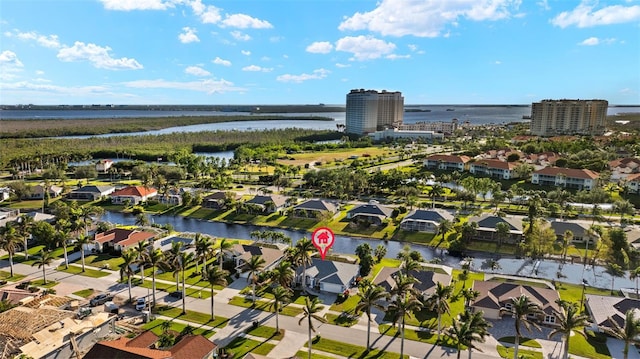 birds eye view of property with a water view