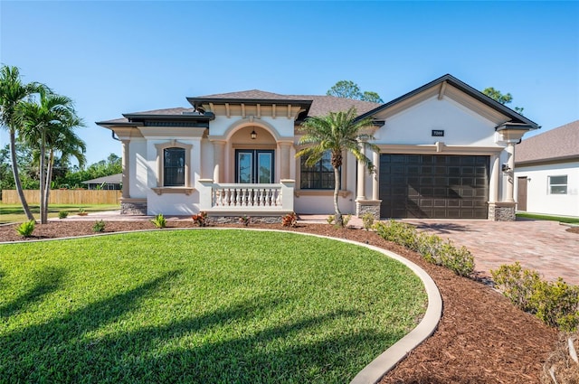 view of front of home featuring a front yard and a garage