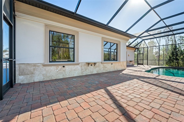 view of pool featuring a patio area and a lanai