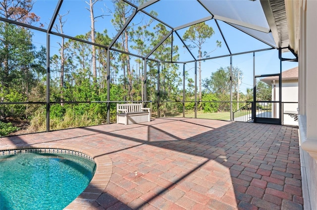 view of patio / terrace featuring a lanai