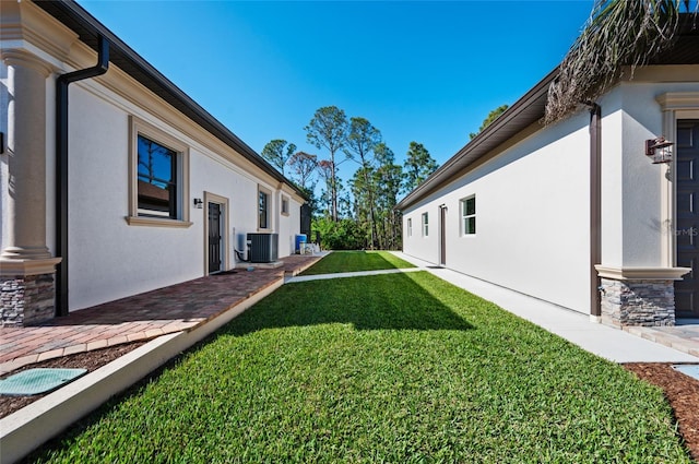 view of yard featuring central AC