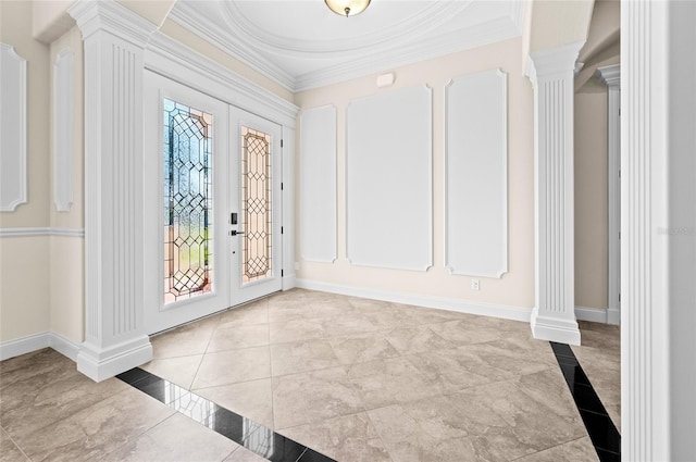 entrance foyer featuring ornate columns, french doors, and ornamental molding