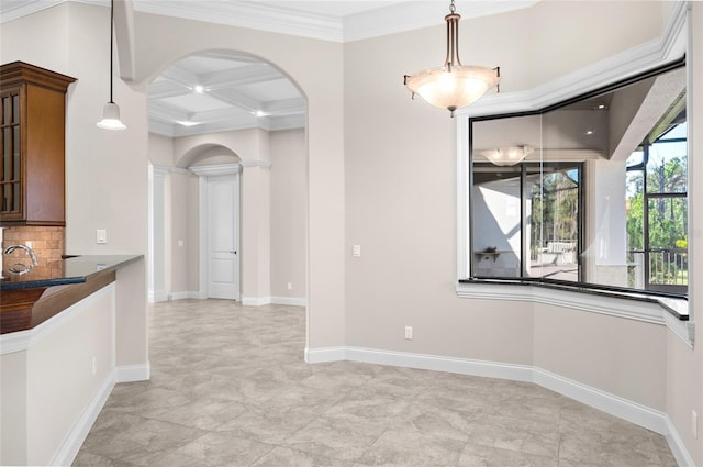 unfurnished dining area featuring ornate columns, crown molding, beamed ceiling, and coffered ceiling