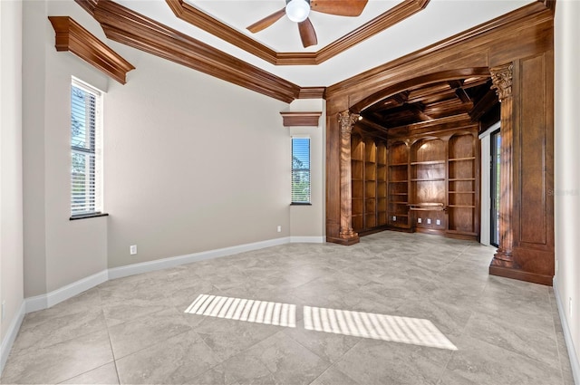 spare room with crown molding, plenty of natural light, and ceiling fan