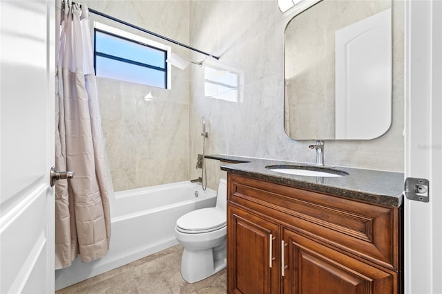 full bathroom featuring vanity, toilet, and shower / tub combo