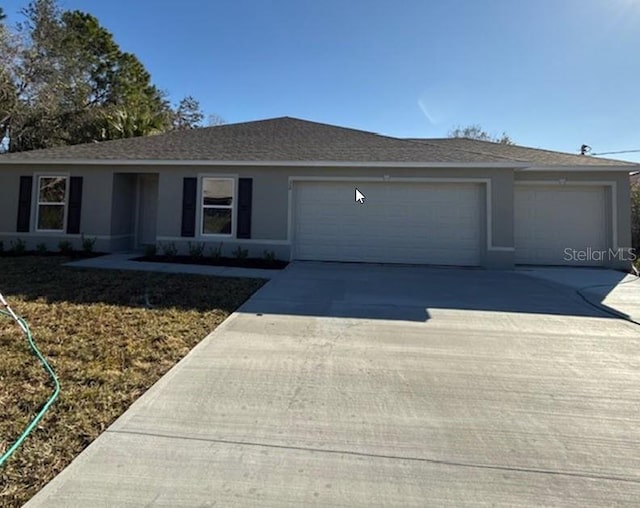 single story home featuring a garage