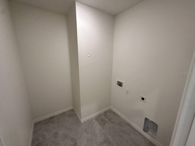 clothes washing area with baseboards, laundry area, washer hookup, and hookup for an electric dryer