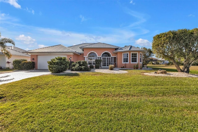 view of front facade featuring a garage and a front lawn