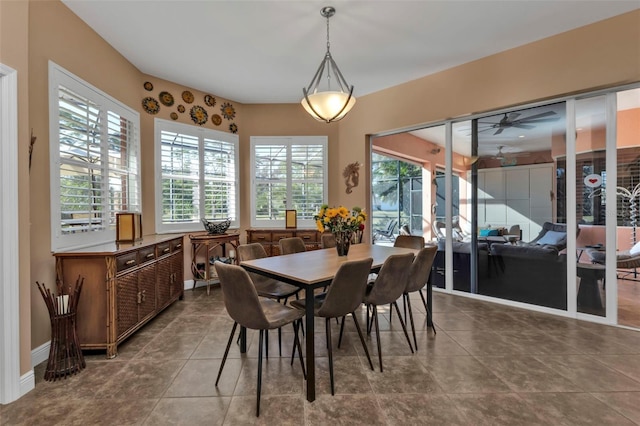 dining room with tile patterned floors and ceiling fan