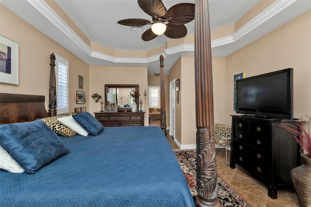 tiled bedroom with multiple windows, a raised ceiling, ceiling fan, and crown molding